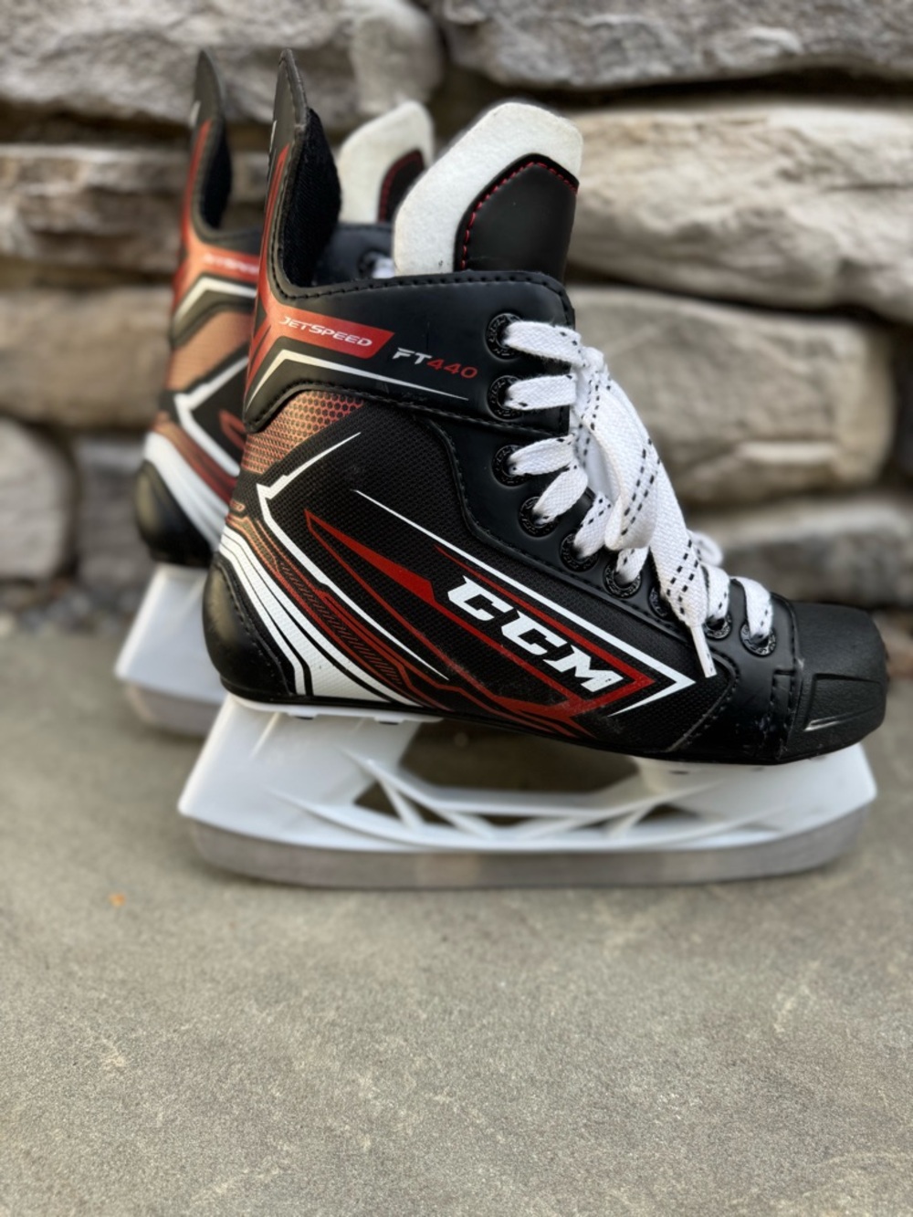 CCM  Youth/Kids Ice Hockey Skates - Black/Red/White